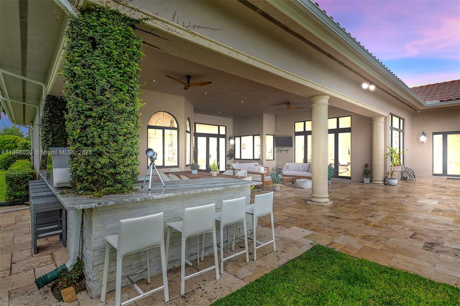 731 Ranch Road Weston, FL 33326 - Photo 28 of 53 a dining room with furniture and a garden