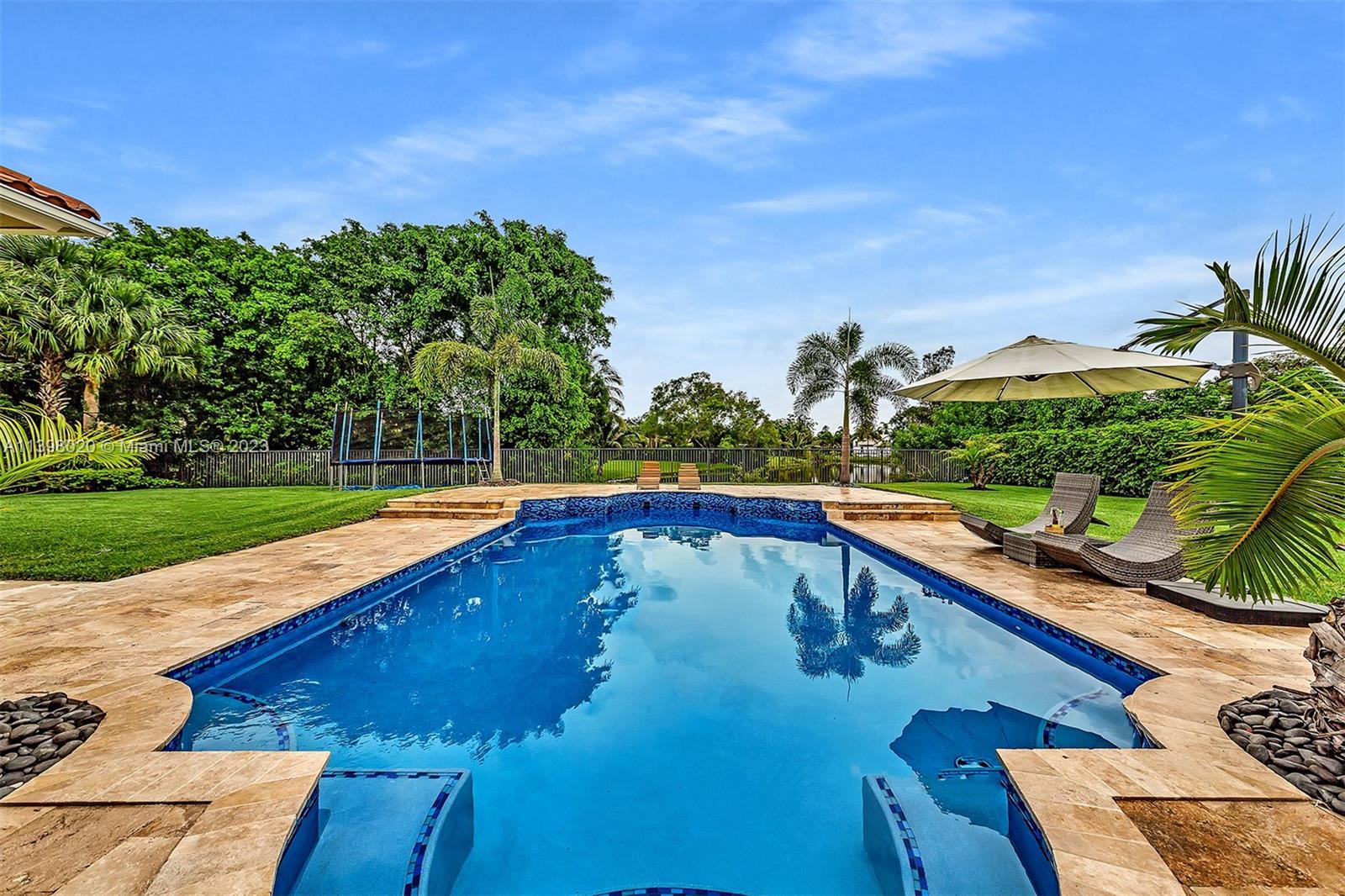 731 Ranch Road Weston, FL 33326 - Photo 30 of 53 a view of swimming pool with a yard