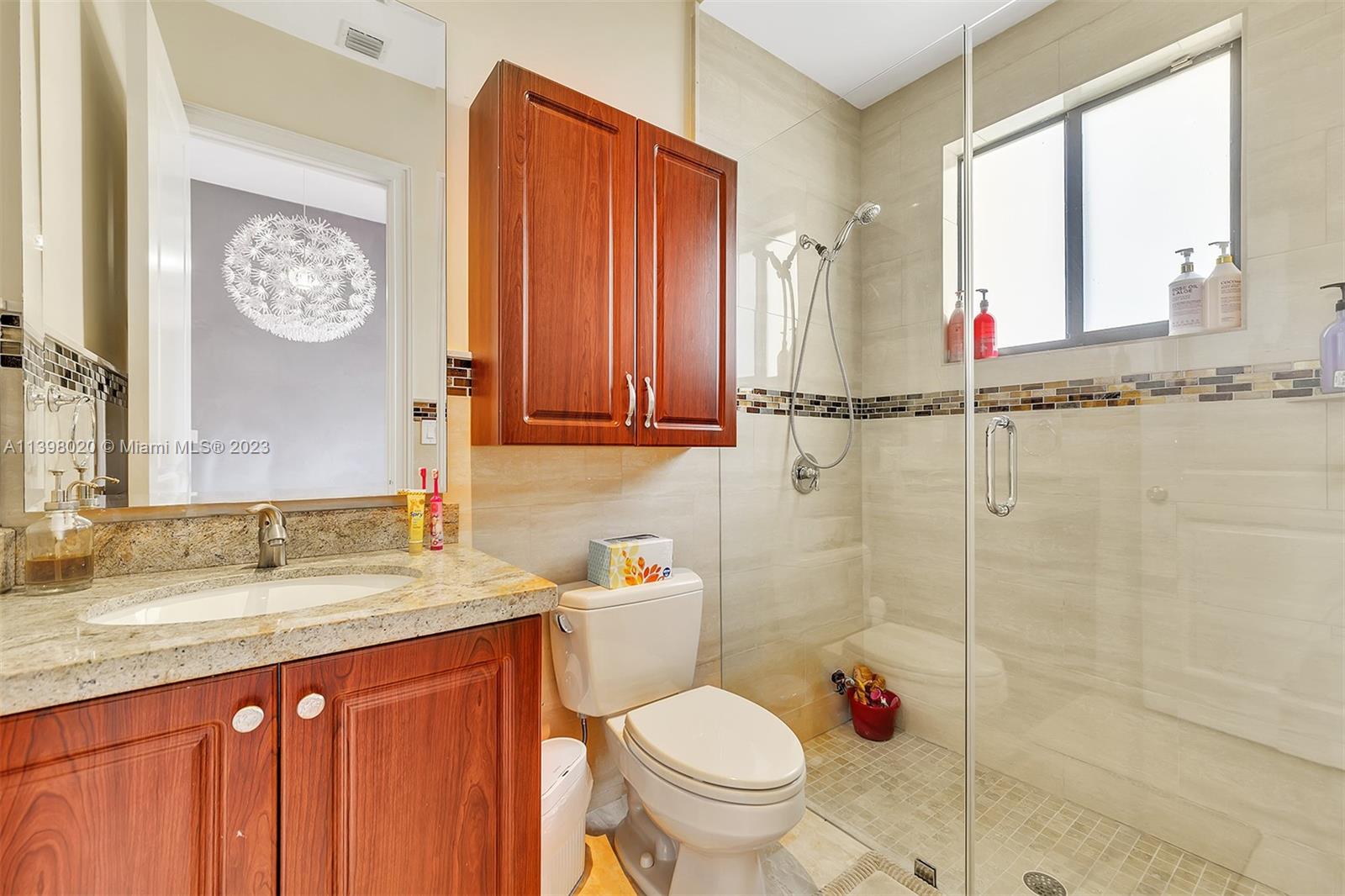731 Ranch Road Weston, FL 33326 - Photo 36 of 53 a bathroom with a granite countertop sink mirror vanity and toilet