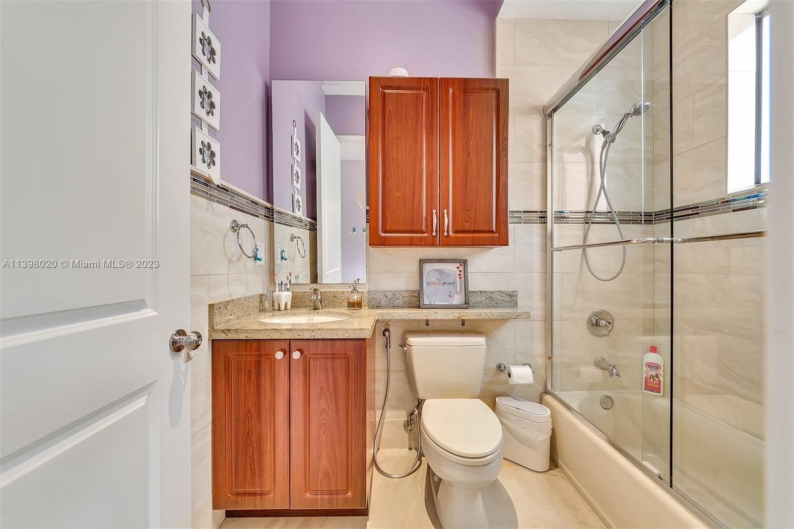 731 Ranch Road Weston, FL 33326 - Photo 39 of 53 a bathroom with a granite countertop toilet sink and mirror