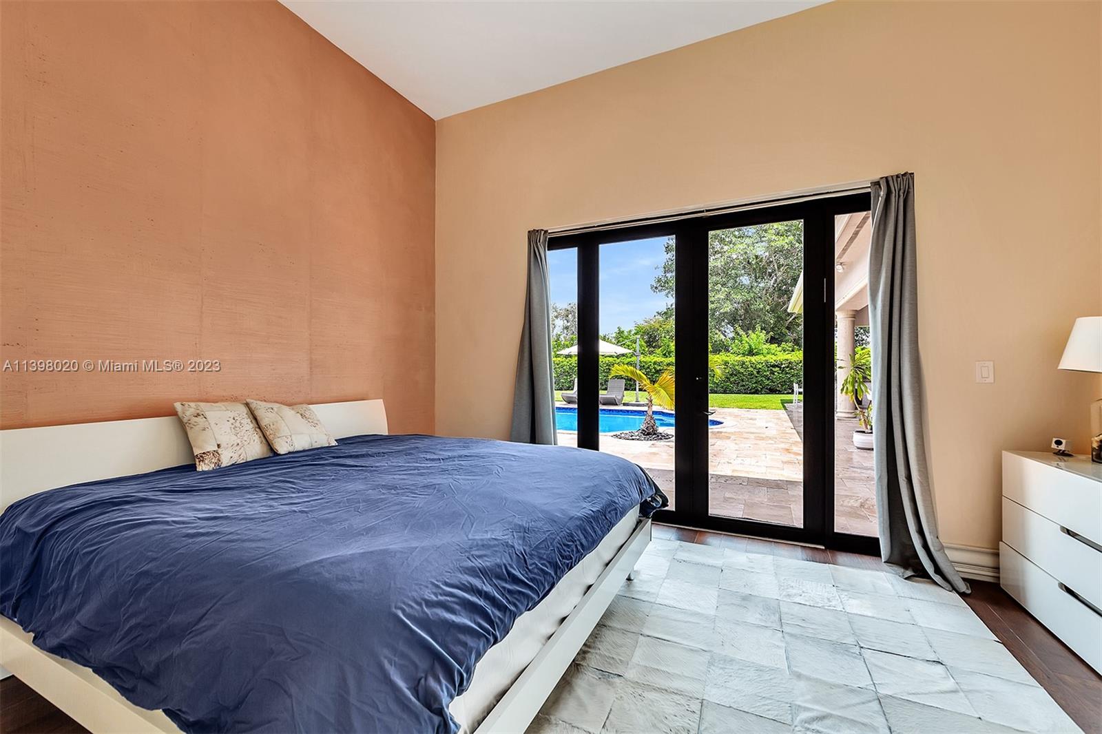 731 Ranch Road Weston, FL 33326 - Photo 42 of 53 a large bed sitting in a bedroom next to a window