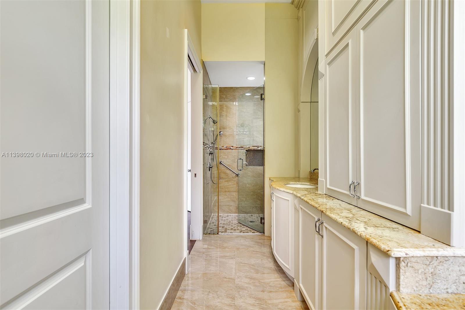731 Ranch Road Weston, FL 33326 - Photo 45 of 53 a bathroom with a sink and a mirror