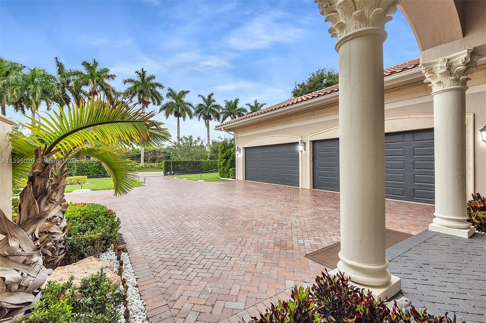 731 Ranch Road Weston, FL 33326 - Photo 49 of 53 a front view of a house with a yard and garage