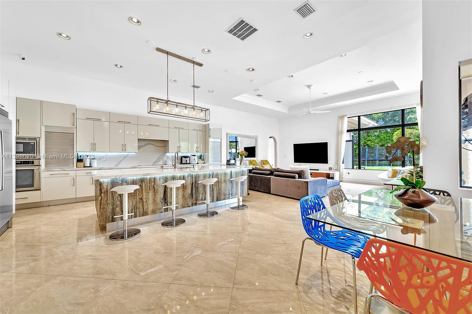 731 Ranch Road Weston, FL 33326 - Photo 5 of 53 a living room with furniture and a flat screen tv