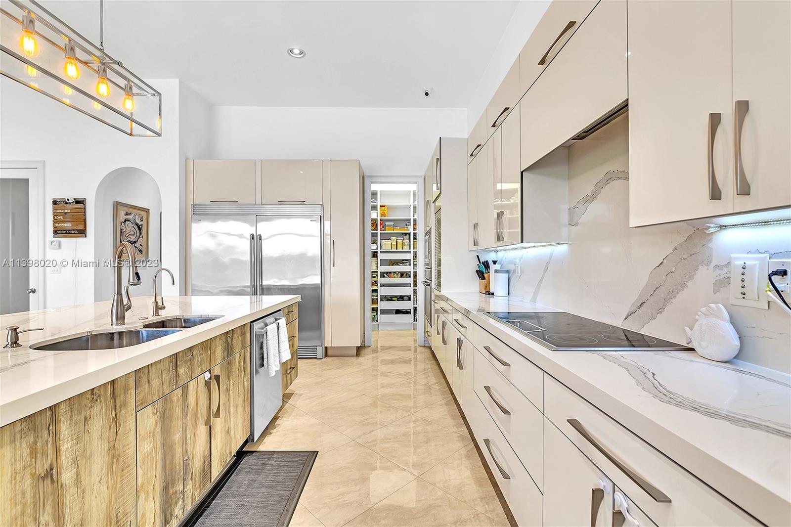 731 Ranch Road Weston, FL 33326 - Photo 8 of 53 a large white kitchen with a large window