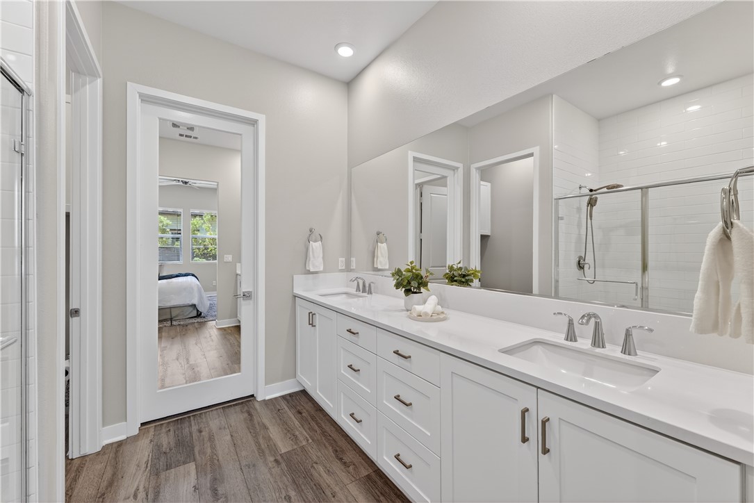 752 Sunrise Road Rancho Mission Viejo, CA 92694 - Photo 21 of 73 a en suite bathroom with a granite countertop sink and a mirror