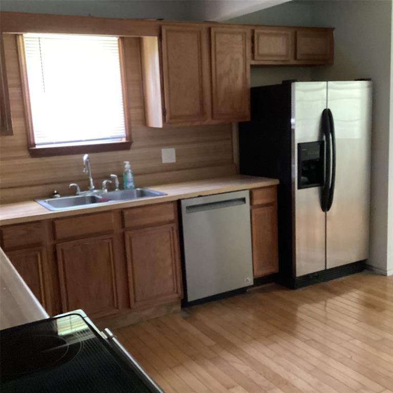 1506 South Travis Street Denison, TX 75021 - Photo 18 of 22 New dishwasher and frig.