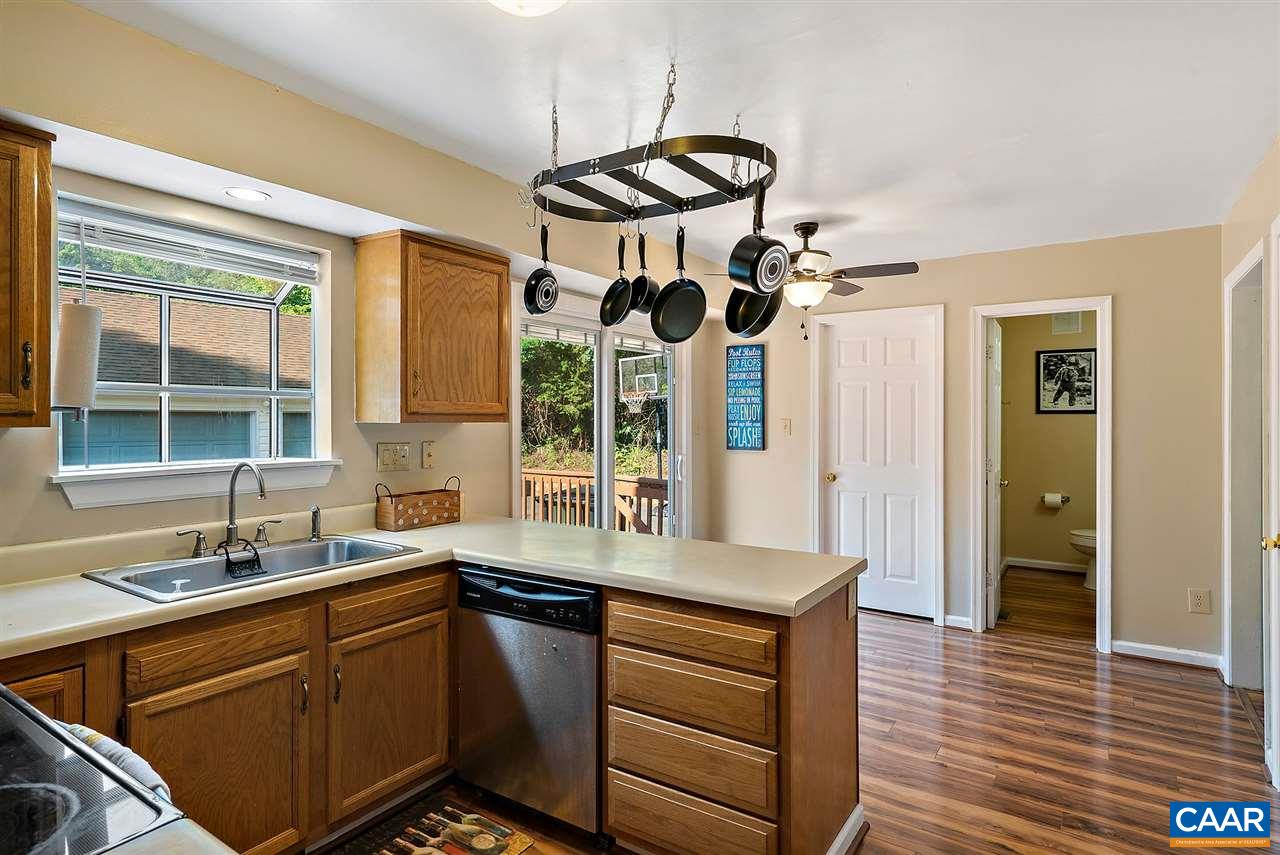 192 Ruckersville Heights Road Ruckersville, VA 22968 - Photo 13 of 35 a kitchen with stainless steel appliances a sink cabinets and a large window