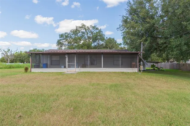a house with swimming pool in front of it