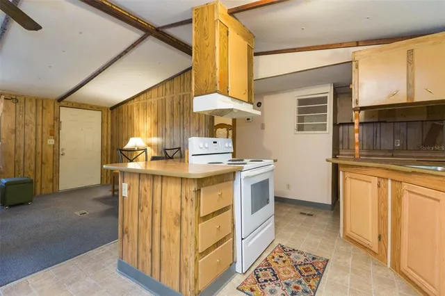 a view of a room with furniture and wooden floor
