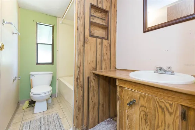 a view of a couches with wooden floor