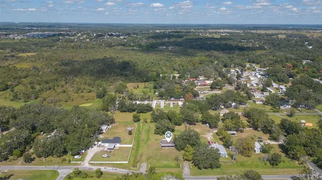 an aerial view of residential building and lake
