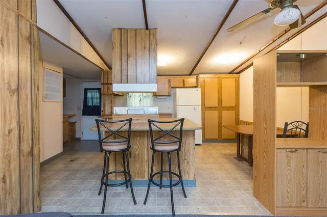 a view of a dining room with furniture and a window
