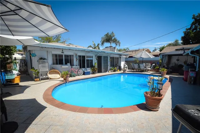 a view of a swimming pool with a patio