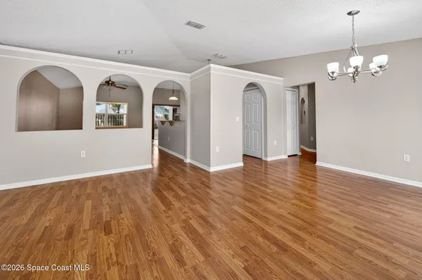 a view of a livingroom with wooden floor