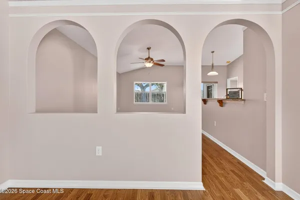 a view of an entryway with wooden floor
