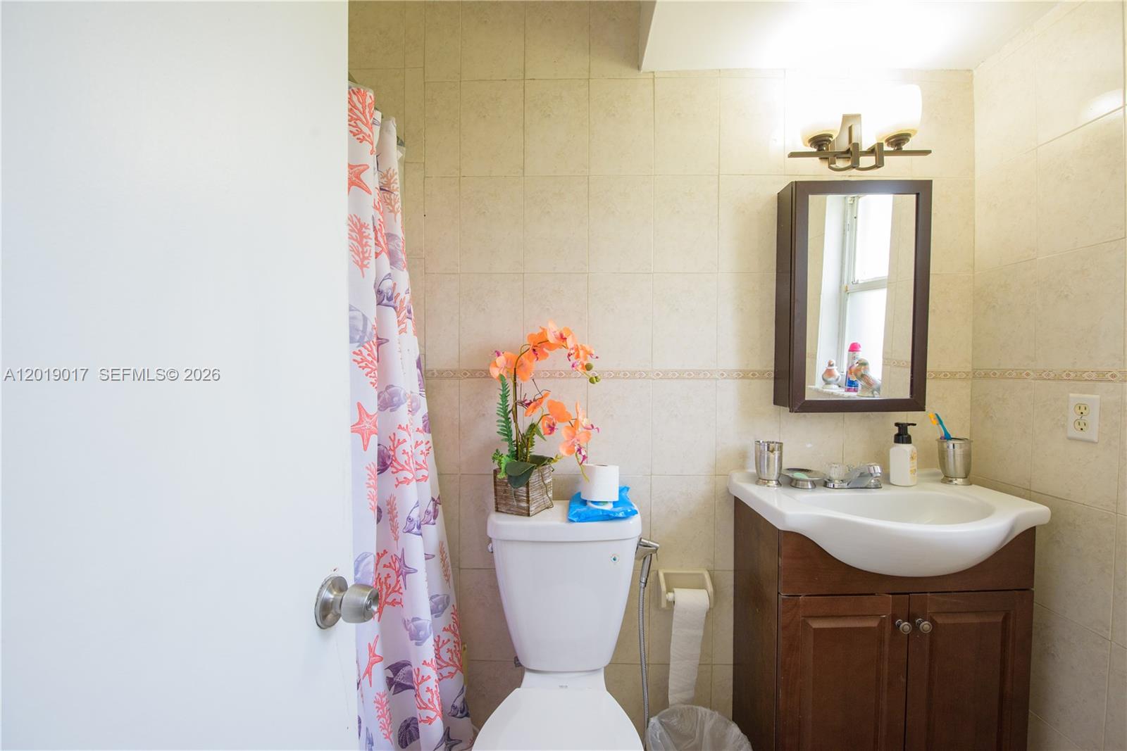 731 Northwest 17th Street Homestead, FL 33030 - Photo 13 of 29 a bathroom with a sink toilet and mirror