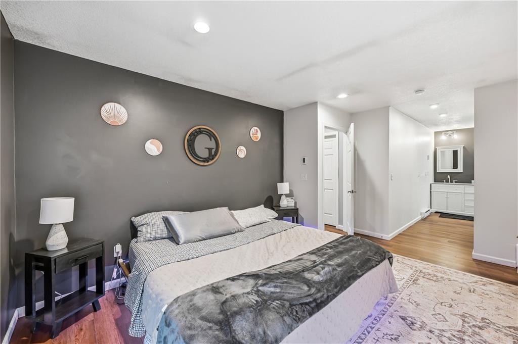 112 Willadell Road Transfer, PA 16154 - Photo 21 of 43 a spacious bedroom with a bed and a lamp