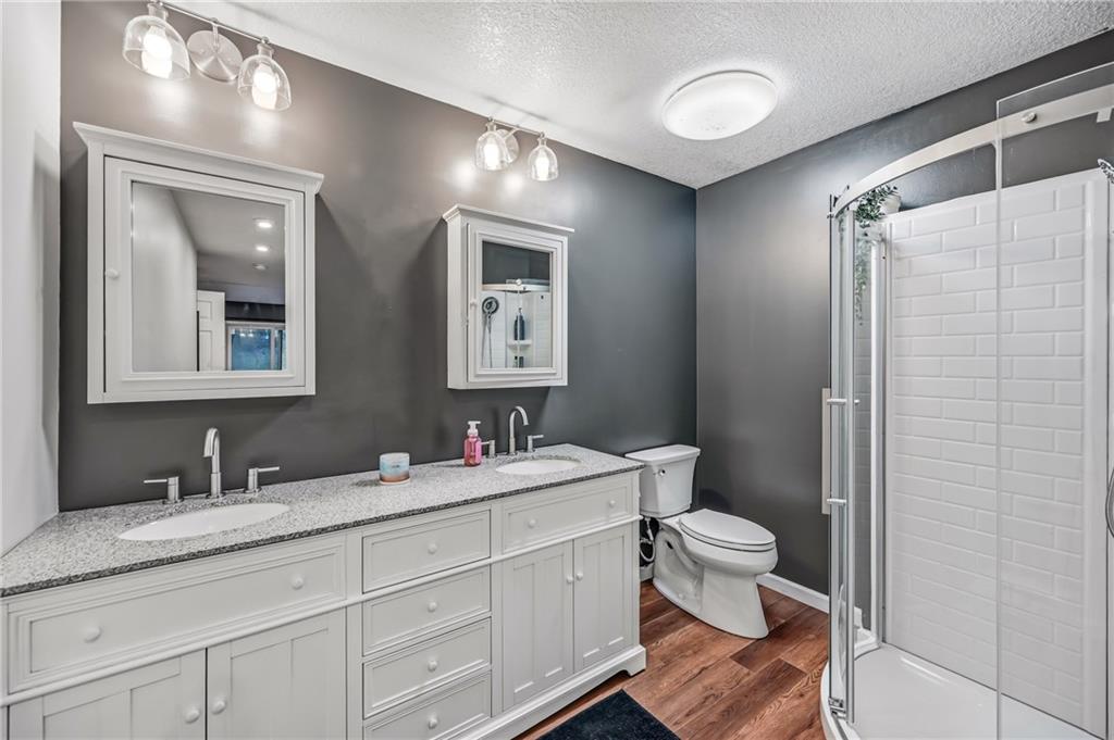 112 Willadell Road Transfer, PA 16154 - Photo 22 of 43 a bathroom with a double vanity sink toilet and a mirror