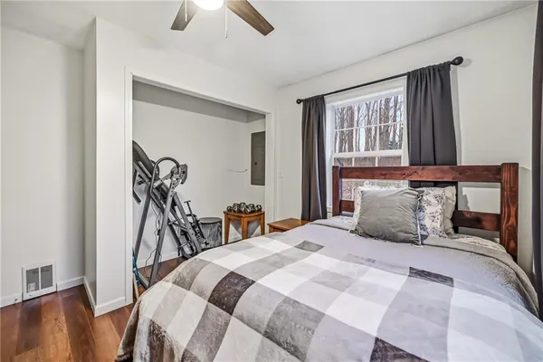 a bedroom with a bed and a window