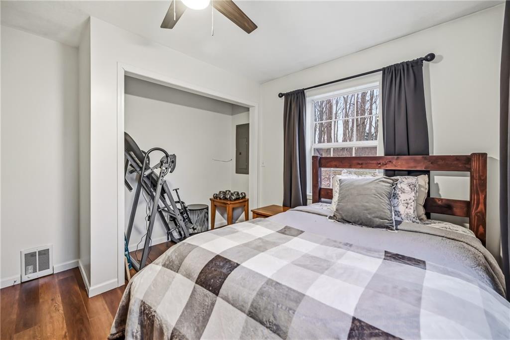 112 Willadell Road Transfer, PA 16154 - Photo 26 of 43 a bedroom with a bed and a chandelier