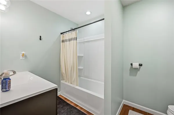 a en suite bathroom with a toilet sink and mirror