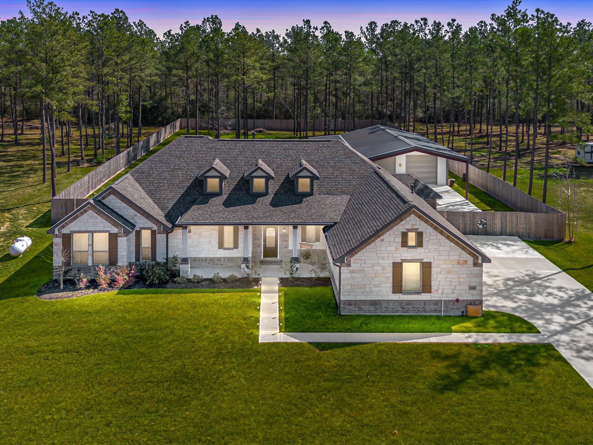 9746 Guadalupe Street Conroe, TX 77303 - Photo 1 of 42 3/4 Acre Home-Site, carved into the Piney Woods of East Conroe, featuring a 3 bedroom+study single-story and 30x40 red iron, insulated shop with extended carport and side awning.