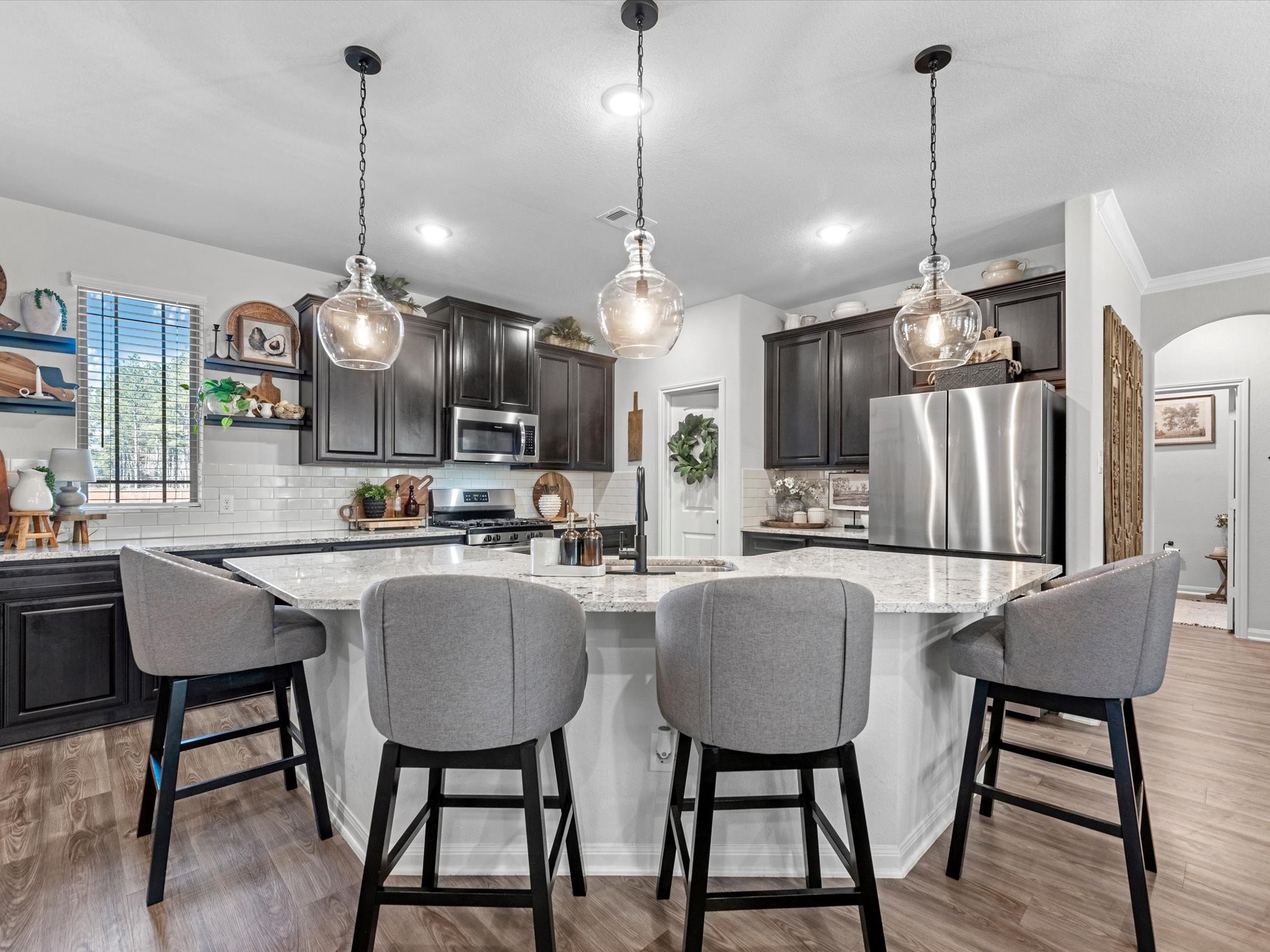 9746 Guadalupe Street Conroe, TX 77303 - Photo 14 of 42 Large island kitchen w/ decorative pendants overhanging