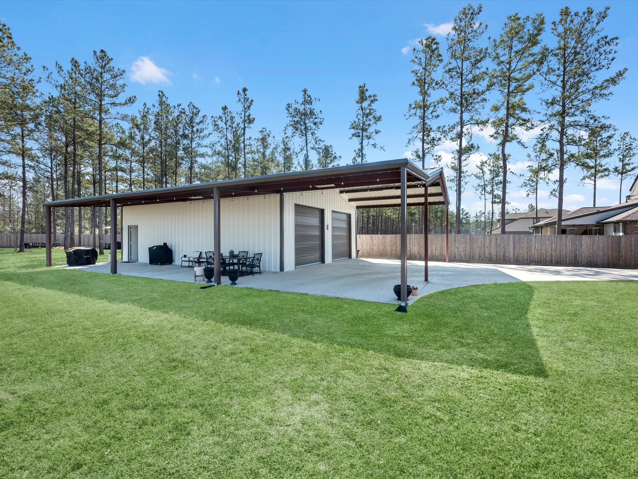 9746 Guadalupe Street Conroe, TX 77303 - Photo 31 of 42 No shortage of storage or outdoor entertaining space, ALL shaded!