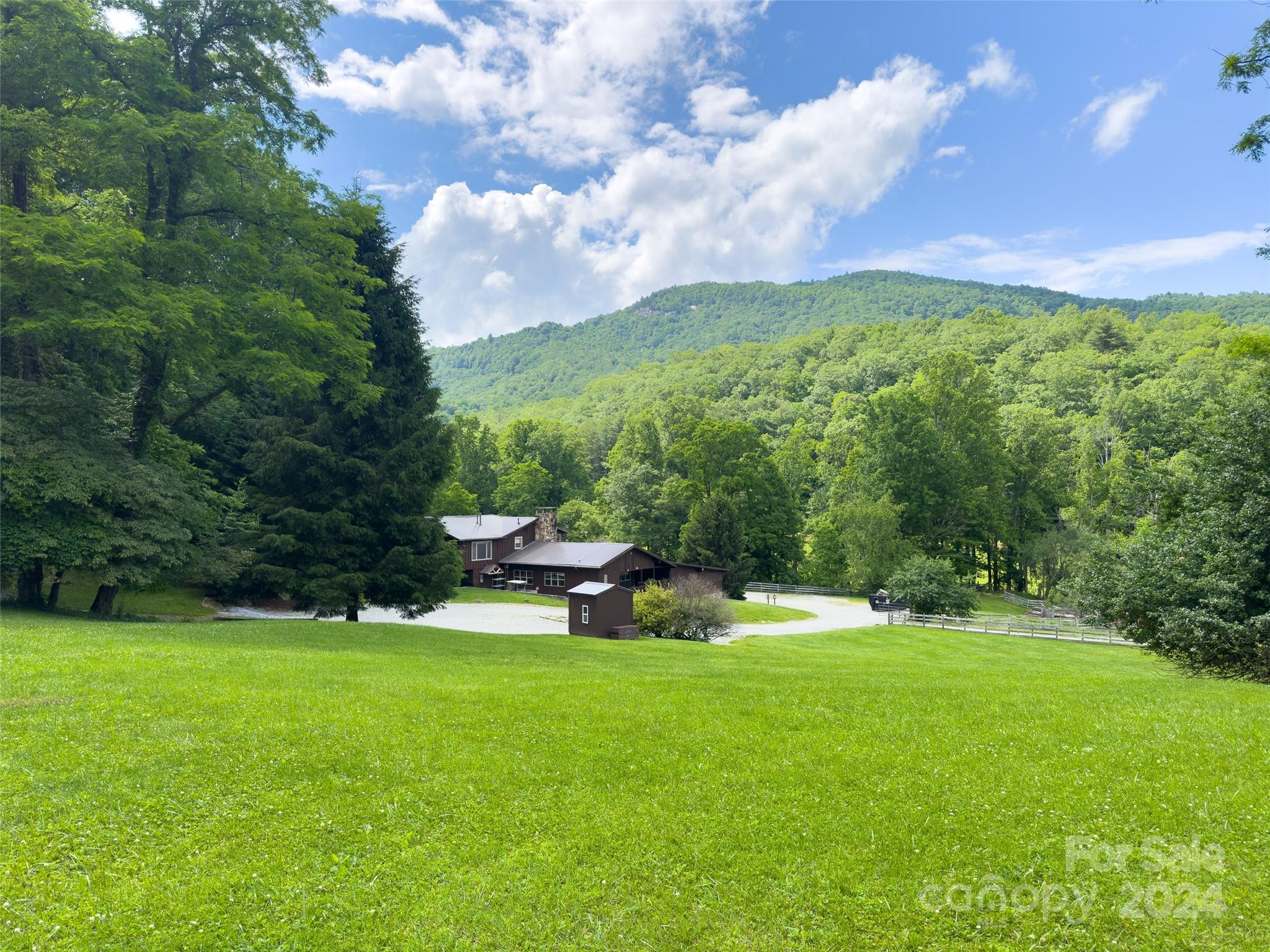 500 Winding Gap Road Lake Toxaway, NC 28747 - Photo 11 of 14 a view of a green field with sitting area