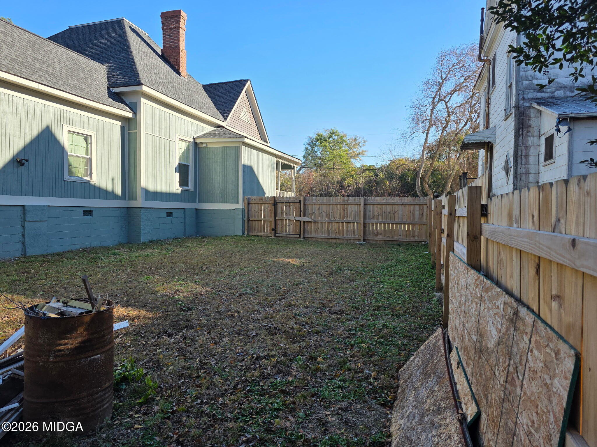 692 Center Street Macon, GA 31217 - Photo 16 of 16 a view of a house with backyard and wooden fence