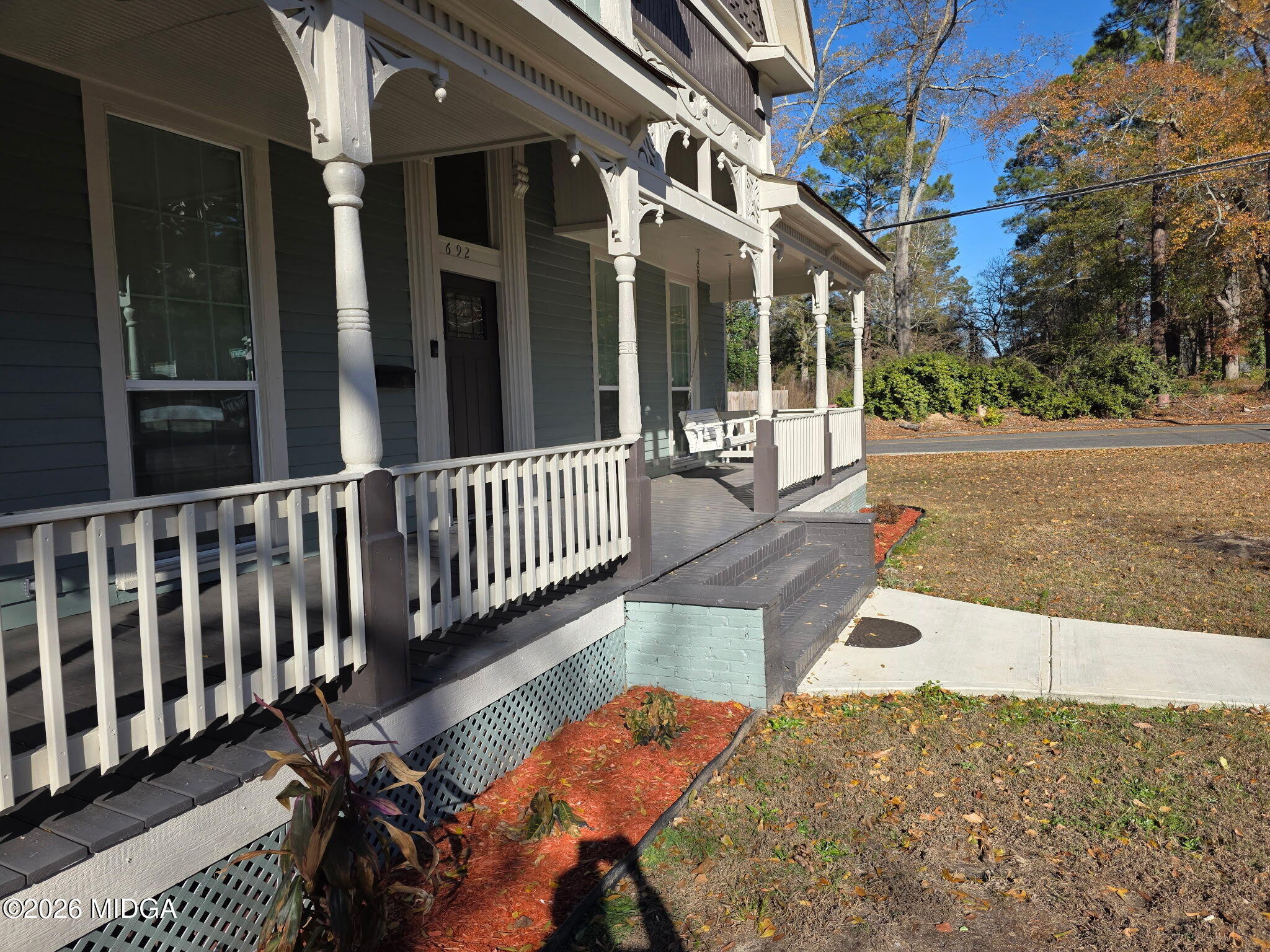 692 Center Street Macon, GA 31217 - Photo 5 of 16 a view of a patio with a table and chairs