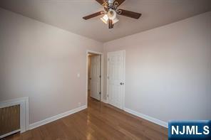 310 Union Street Carlstadt, NJ 07072 - Photo 20 of 24 a view of an empty room and chandelier fan