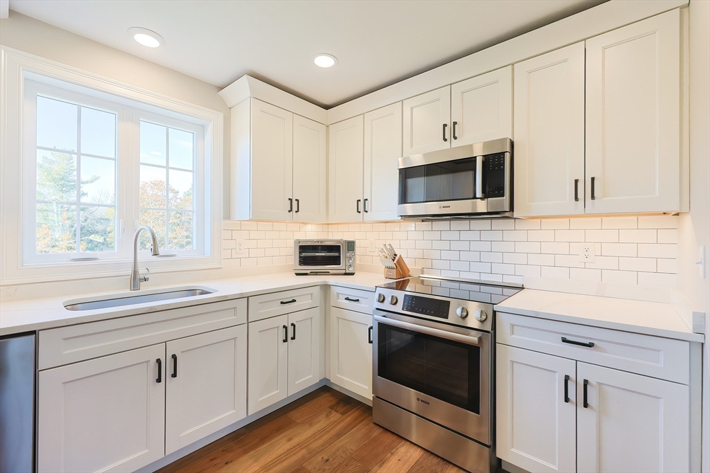 11 Lighthouse Lane Westminster, MA 01473 - Photo 7 of 42 a kitchen with appliances cabinets and a sink