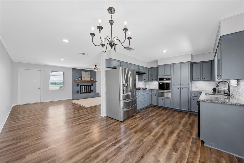 2988 East Old Axtell Road Axtell, TX 76624 - Photo 12 of 38 a view of a kitchen with a sink stainless steel appliances and cabinets