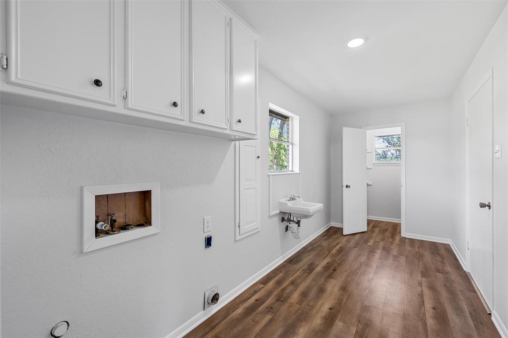 2988 East Old Axtell Road Axtell, TX 76624 - Photo 13 of 38 a view of a room with wooden floor and cabinet