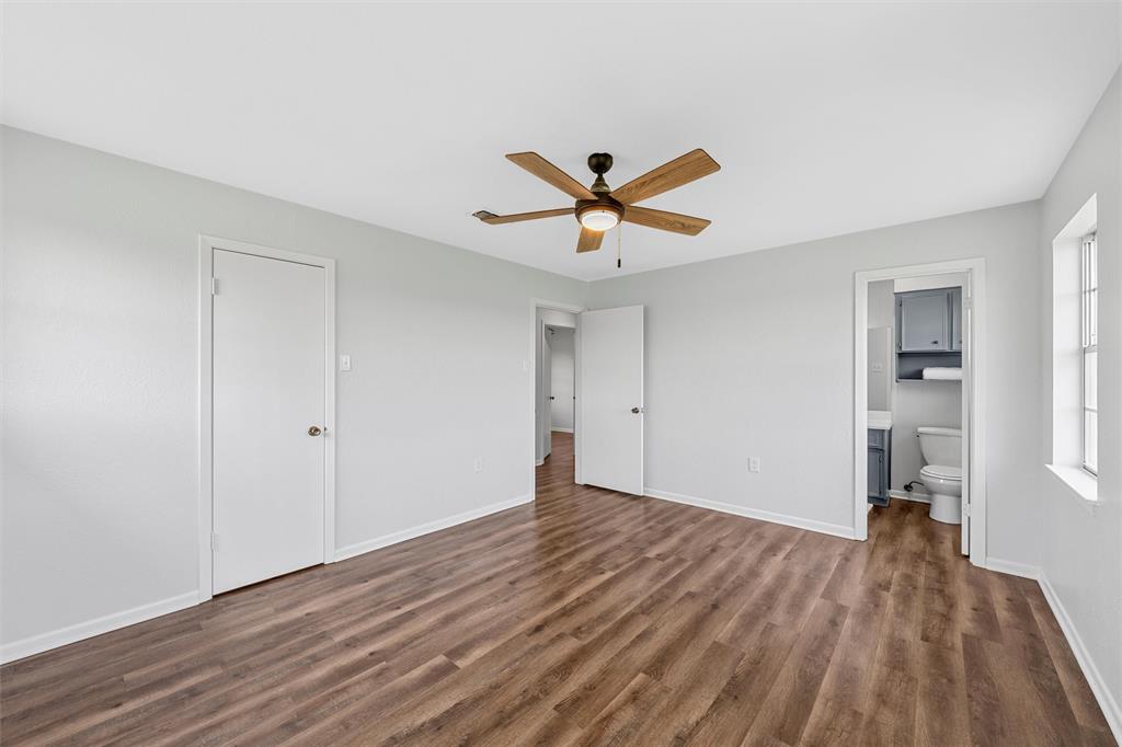 2988 East Old Axtell Road Axtell, TX 76624 - Photo 17 of 38 a view of a room with wooden floor and a ceiling fan