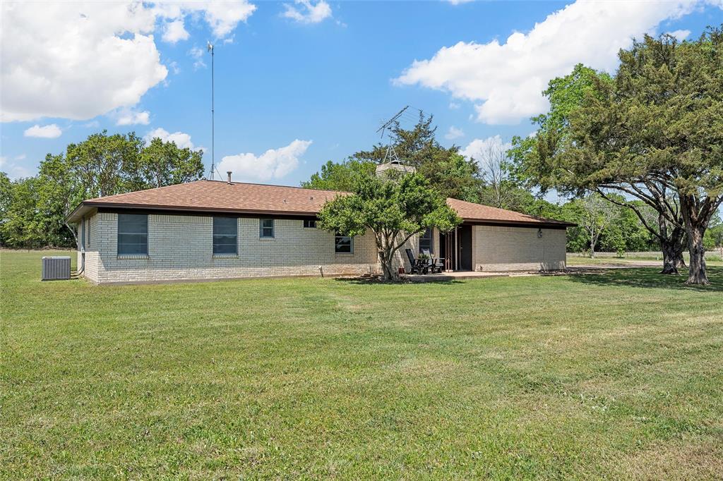 2988 East Old Axtell Road Axtell, TX 76624 - Photo 27 of 38 a front view of a house with a garden