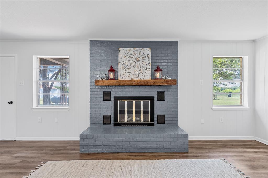 2988 East Old Axtell Road Axtell, TX 76624 - Photo 6 of 38 a living room with furniture and a fireplace