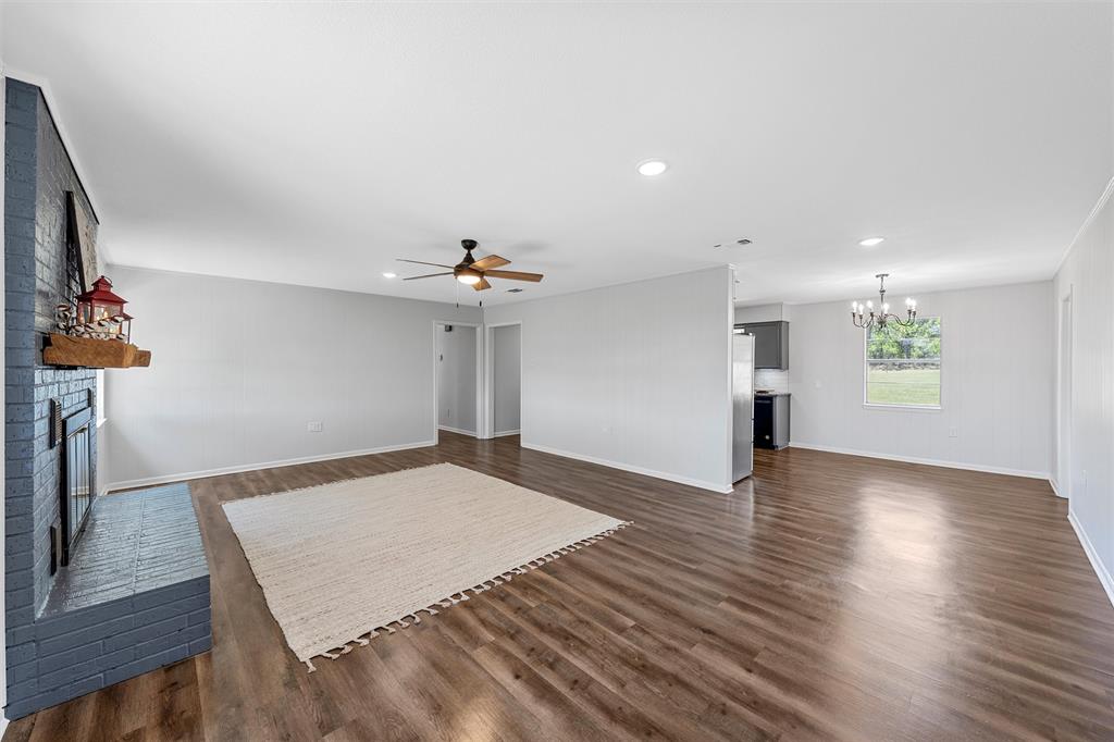 2988 East Old Axtell Road Axtell, TX 76624 - Photo 7 of 38 a view of an empty room and wooden floor