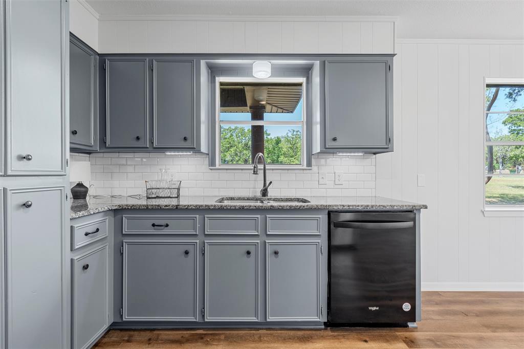 2988 East Old Axtell Road Axtell, TX 76624 - Photo 10 of 38 a kitchen with cabinets appliances and a window