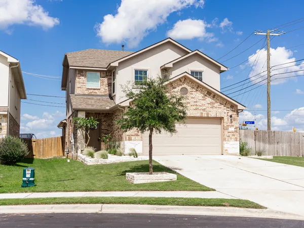 a front view of a house with a yard