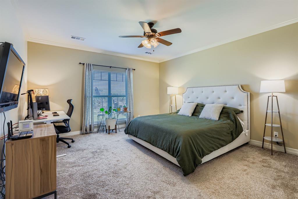 785 Schneider Road Howe, TX 75459 - Photo 11 of 40 Bedroom with an office area, ornamental molding, carpet floors, and ceiling fan