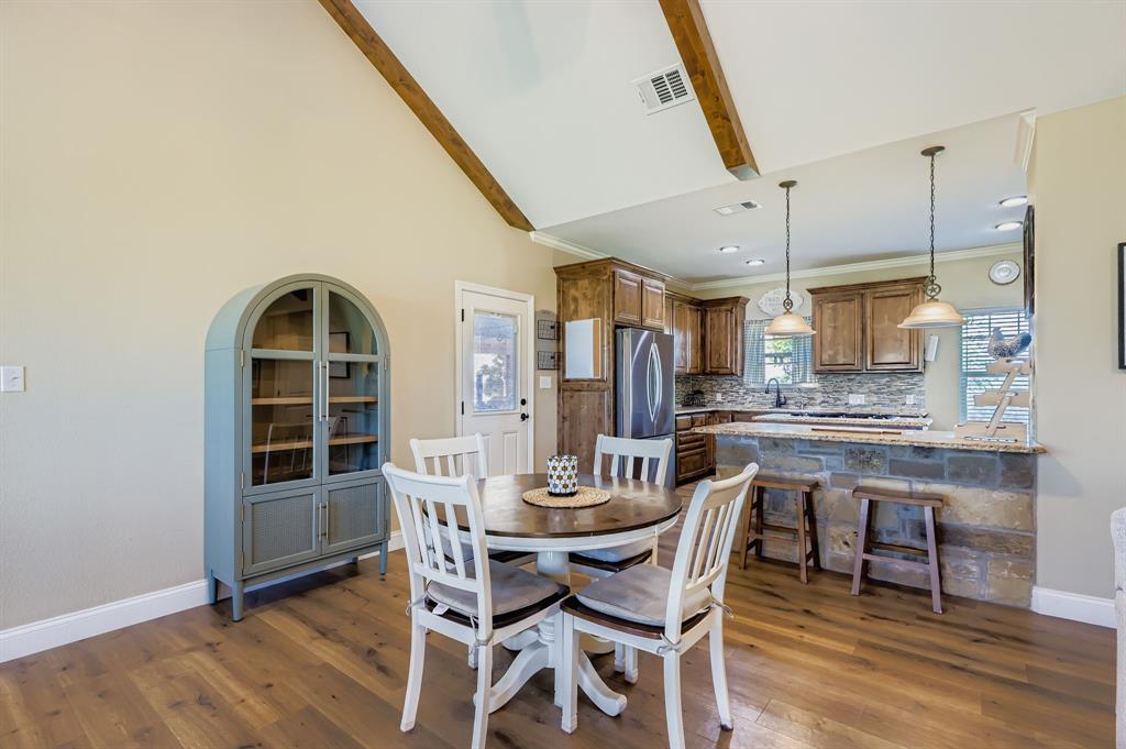 785 Schneider Road Howe, TX 75459 - Photo 25 of 40 Dining room with dark wood-type flooring, vaulted ceiling, crown molding, and recessed lighting