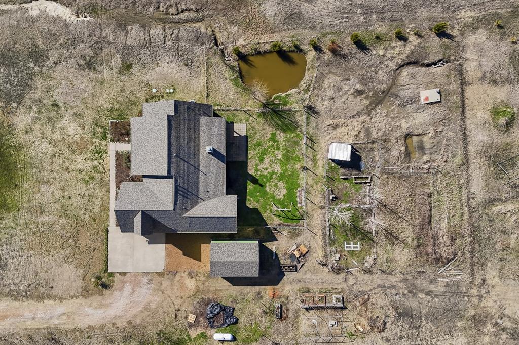 785 Schneider Road Howe, TX 75459 - Photo 33 of 40 Aerial view of property and surrounding area featuring a large body of water