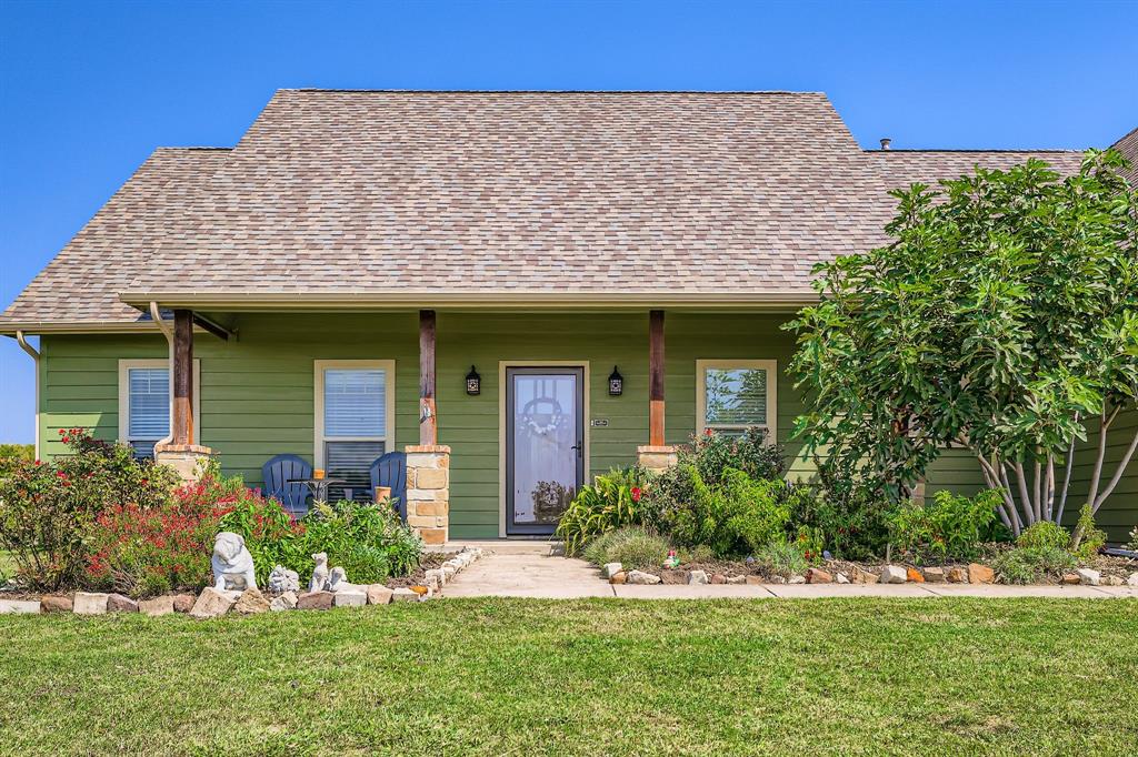 785 Schneider Road Howe, TX 75459 - Photo 39 of 40 View of front of house featuring a front lawn, a porch, and a shingled roof