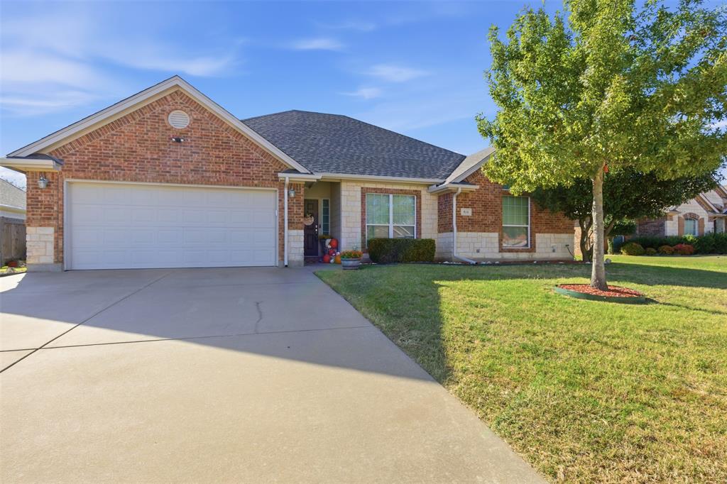 814 Chestnut Grove Drive Cleburne, TX 76033 - Photo 1 of 40 a front view of house with yard and green space