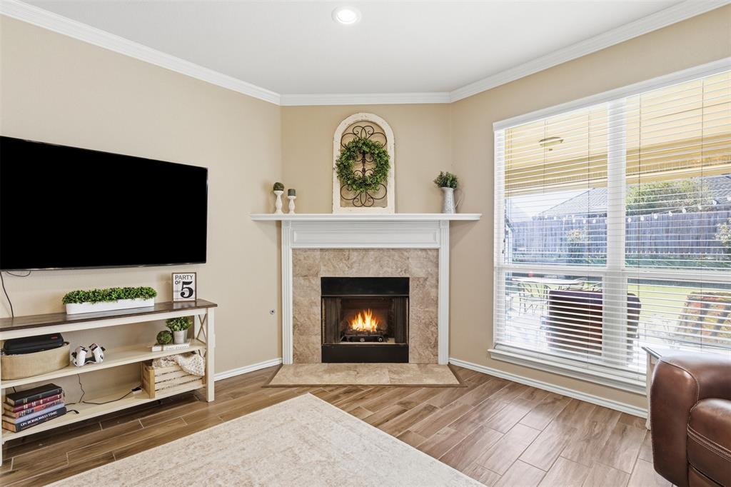 814 Chestnut Grove Drive Cleburne, TX 76033 - Photo 12 of 40 a living room with furniture and a flat screen tv