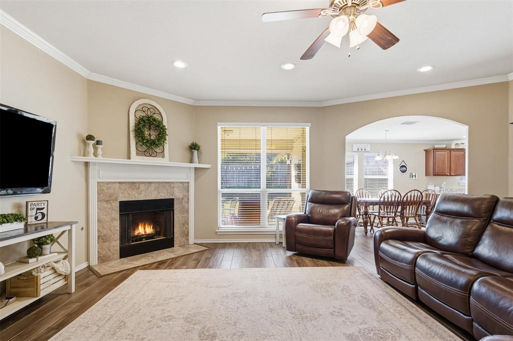 814 Chestnut Grove Drive Cleburne, TX 76033 - Photo 13 of 40 a living room with furniture and a fireplace