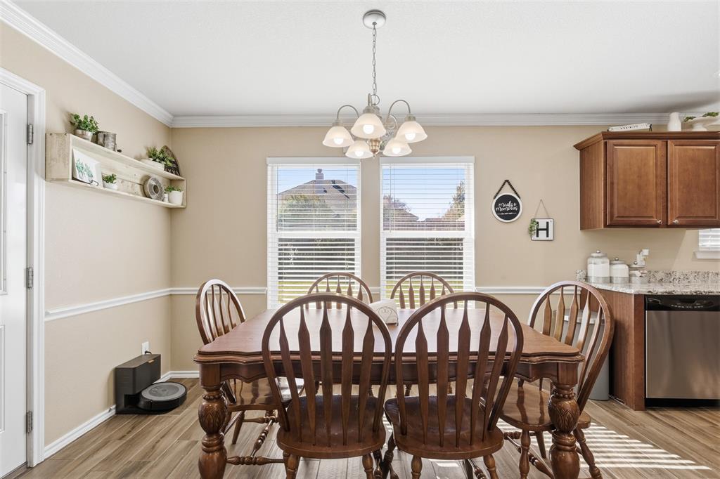 814 Chestnut Grove Drive Cleburne, TX 76033 - Photo 14 of 40 a view of a dining room with furniture window and wooden floor